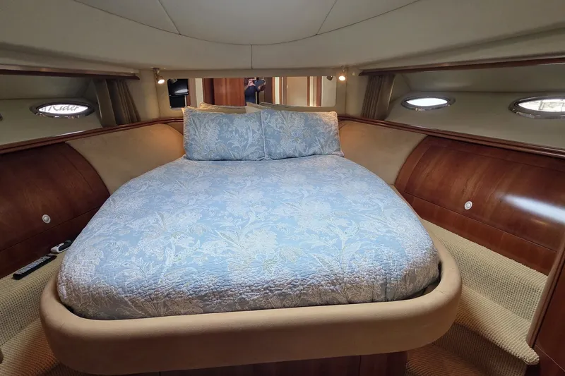 Slide: The Image of Luxurious bedroom interior of 2005 Sea Ray 550 Sedan Bridge yacht with elegant bedding. - 54
