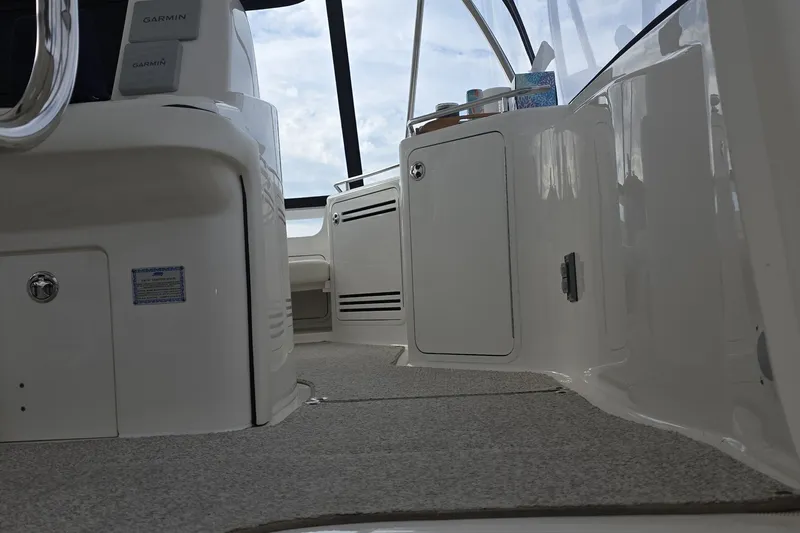 Slide: The Image of Interior view of 2005 Sea Ray 550 Sedan Bridge yacht cockpit with Garmin equipment. - 20