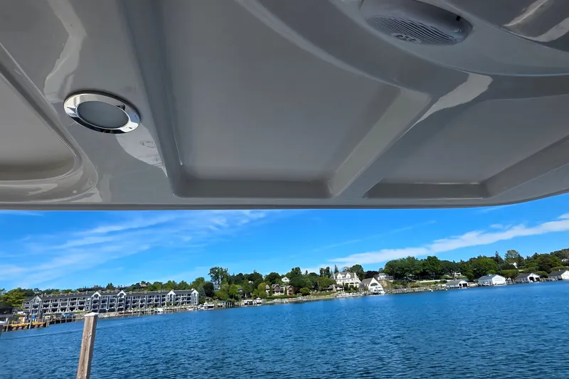 Slide: The Image of View from a 2005 Sea Ray 550 Sedan Bridge, overlooking a serene waterfront scene. - 65