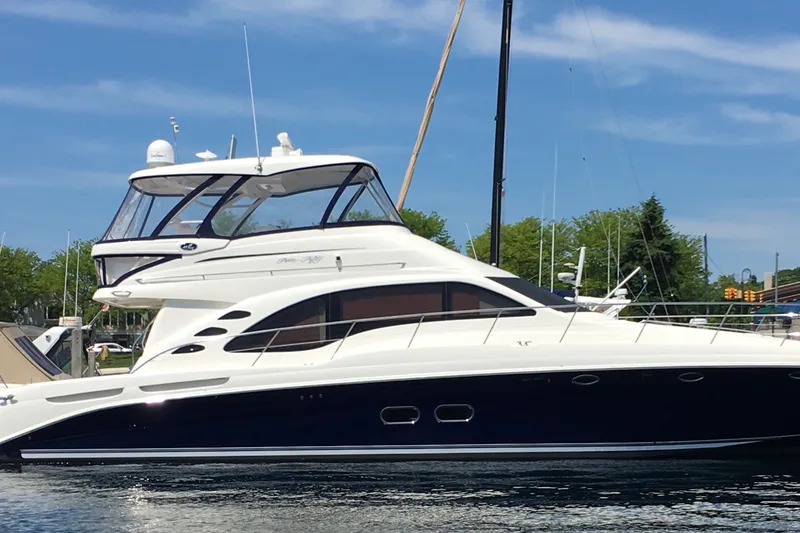 The Image of 2005 Sea Ray 550 Sedan Bridge yacht docked on a sunny day. - 0