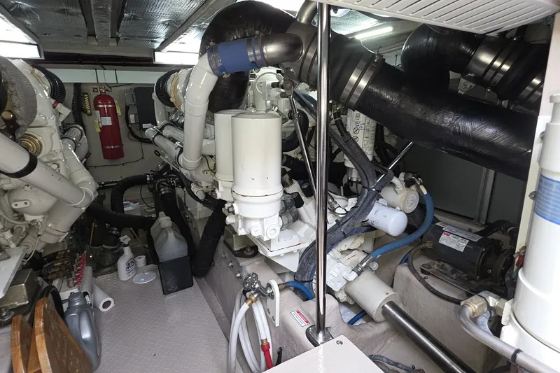 Slide: The Image of Engine room of a 2005 Sea Ray 550 Sedan Bridge yacht, showcasing mechanical components. - 86