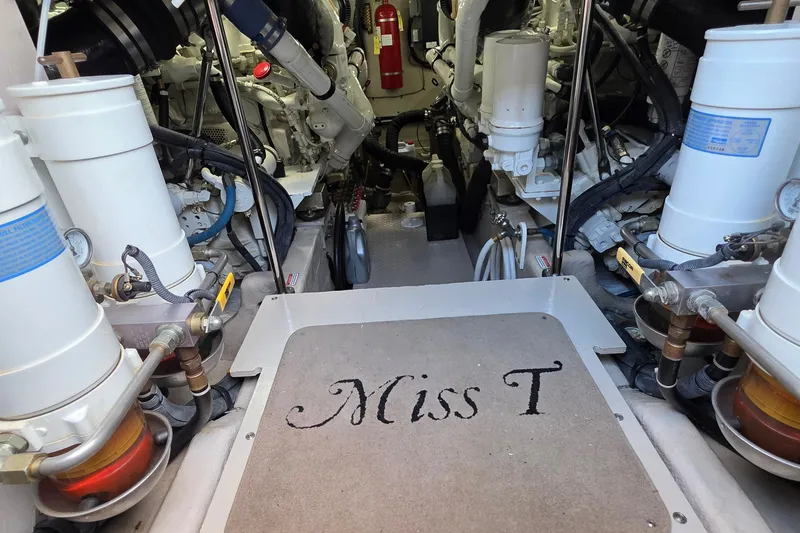 Slide: The Image of Engine room of 2005 Sea Ray 550 Sedan Bridge yacht, featuring "Miss T" mat. - 81