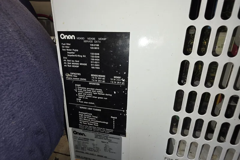 Slide: The Image of Onan generator service data panel on a 2005 Sea Ray 550 Sedan Bridge. - 69