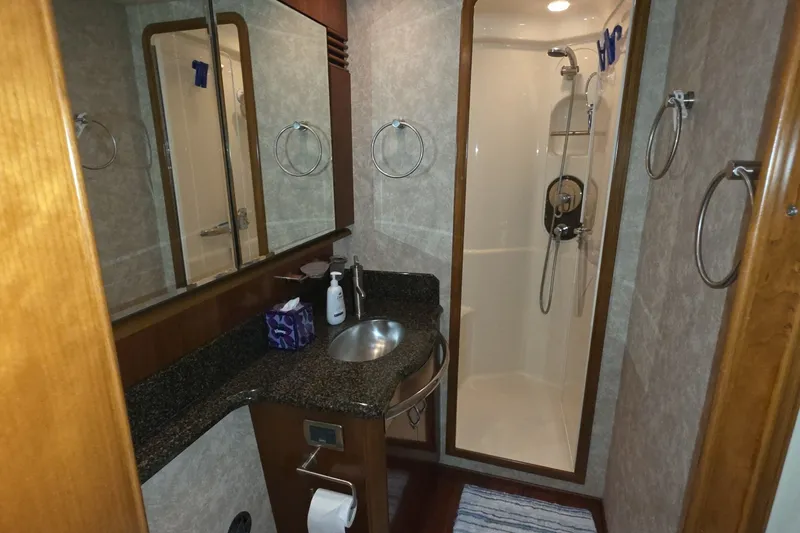 Slide: The Image of Luxurious bathroom in 2005 Sea Ray 550 Sedan Bridge yacht with shower and sink. - 45