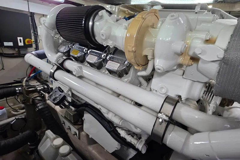 Slide: The Image of Engine room of 2005 Sea Ray 550 Sedan Bridge yacht, showcasing detailed machinery components. - 85