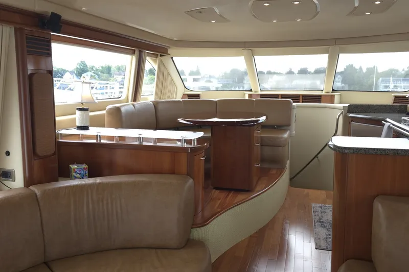 Slide: The Image of Luxurious interior of 2005 Sea Ray 550 Sedan Bridge yacht with elegant seating and wood finishes. - 38