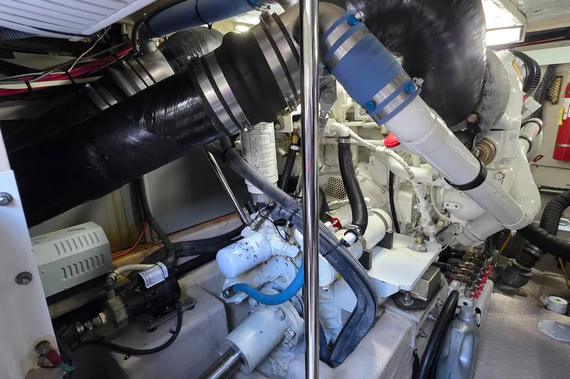 Slide: The Image of Engine room of a 2005 Sea Ray 550 Sedan Bridge yacht, showcasing mechanical components. - 80
