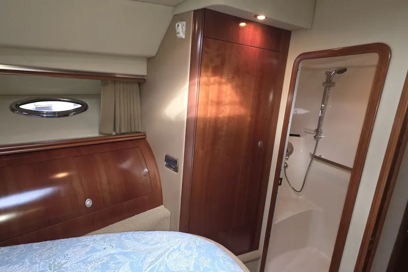 Slide: The Image of Luxurious 2005 Sea Ray 550 Sedan Bridge cabin with wood accents and shower. - 43