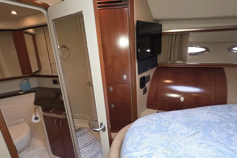 Slide: The Image of Interior of 2005 Sea Ray 550 Sedan Bridge yacht, featuring bedroom and bathroom. - 47