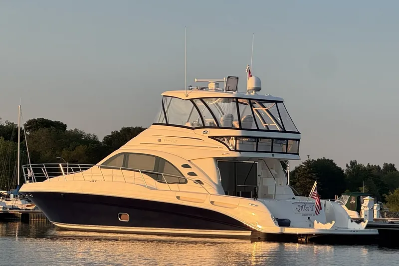 The Image of 2005 Sea Ray 550 Sedan Bridge yacht docked at sunset. - 0
