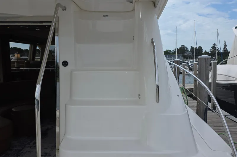 Slide: The Image of Staircase on 2005 Sea Ray 550 Sedan Bridge yacht, leading to upper deck. - 18