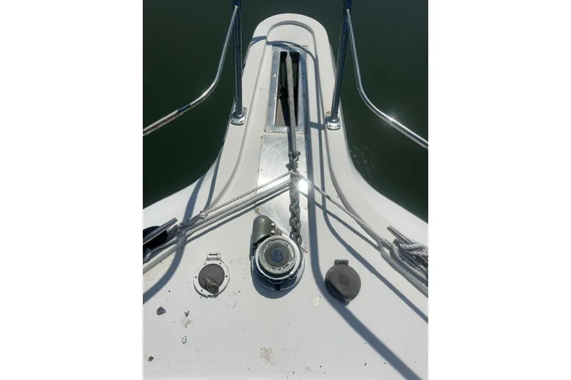 Slide: The Image of Bow of 1995 Carver 355 Aft Cabin Motor Yacht with anchor chain and winch. - 30
