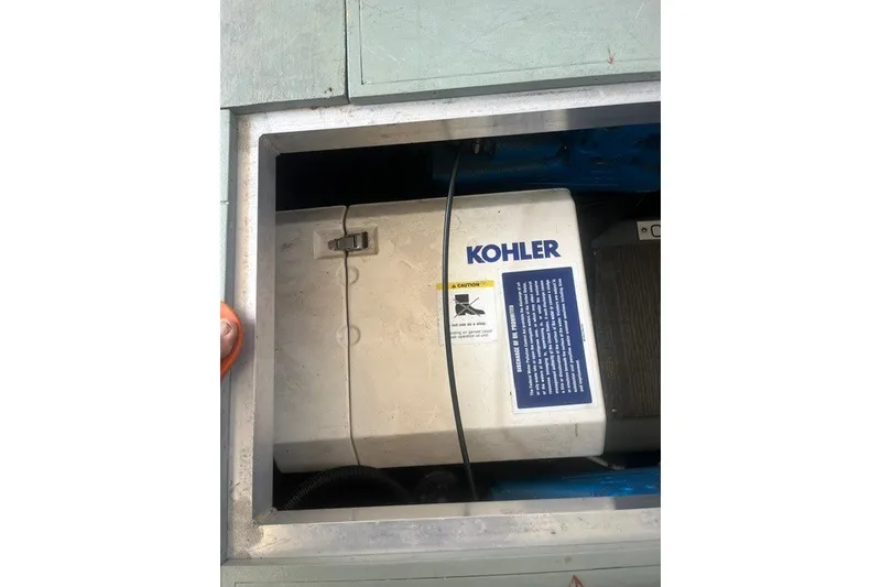 Slide: The Image of Kohler generator inside 1995 Carver 355 Aft Cabin Motor Yacht engine compartment. - 27