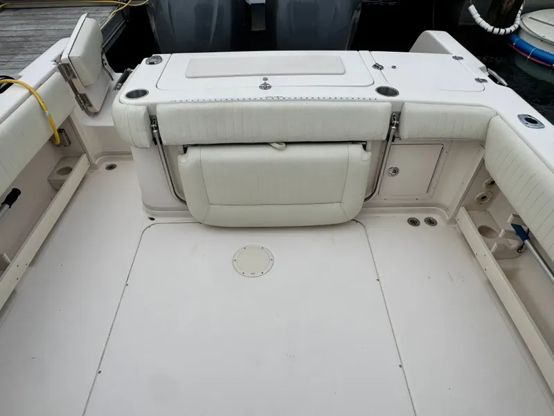 Slide: The Image of The image shows the cockpit of a 2006 Grady-White Sailfish 282 with cushioned seating. - 15