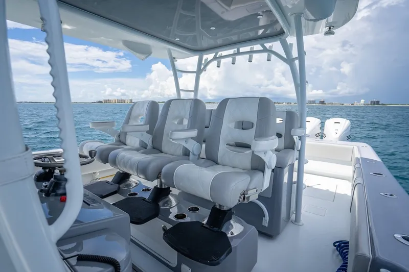 Slide: The Image of 2024 Contender 44 ST boat interior with luxurious seating on open water. - 22