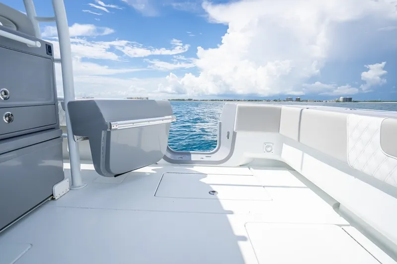 Slide: The Image of 2024 Contender 44 ST boat interior with ocean view, featuring sleek seating and storage. - 17