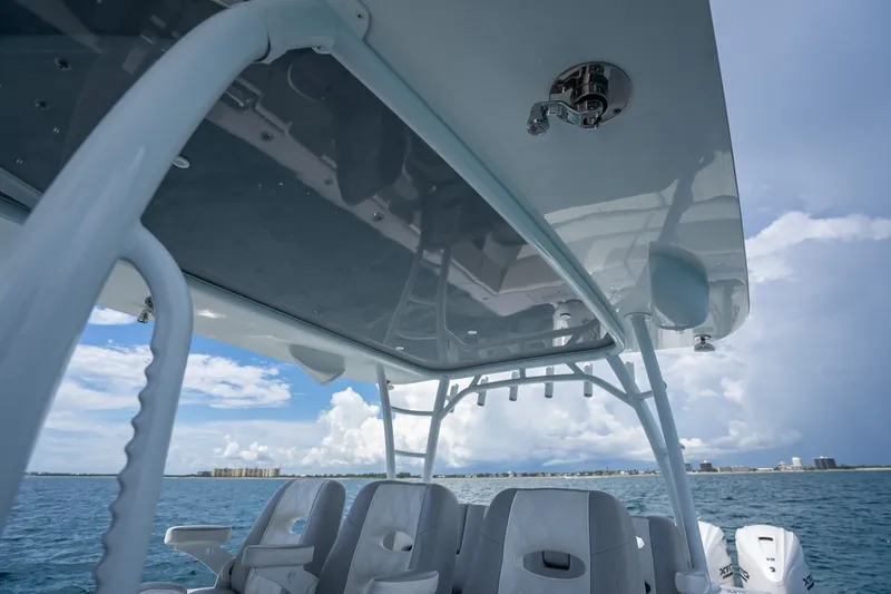 Slide: The Image of 2024 Contender 44 ST boat interior with ocean view and modern seating. - 27