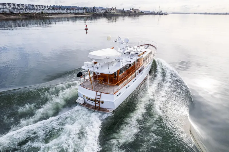Slide: The Image of Vintage 1965 De Vries Lentsch 64 Motoryacht cruising on calm waters. - 94