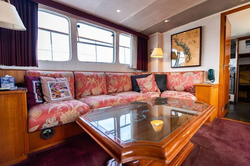 Slide: The Image of Luxurious 1965 De Vries Lentsch 64 Motoryacht interior with floral upholstery and elegant decor. - 30
