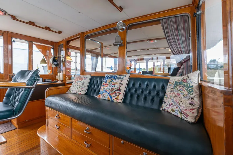 Slide: The Image of Luxurious interior of 1965 De Vries Lentsch 64 Motoryacht with leather seating and nautical decor. - 13