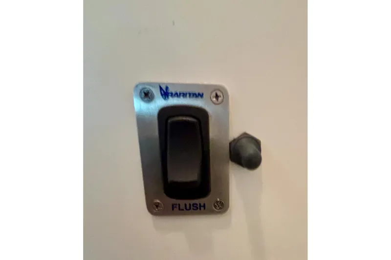Slide: The Image of Flush switch on 1992 Tiara Sport 270 Sport boat, labeled "Marinco." - 44