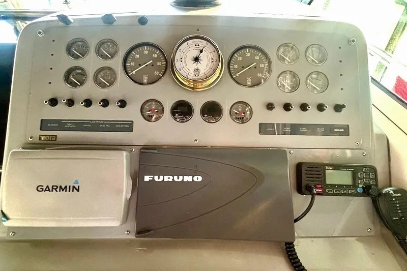 Slide: The Image of Dashboard of a 1992 Tiara 270 Sport boat with Garmin and Furuno equipment. - 11