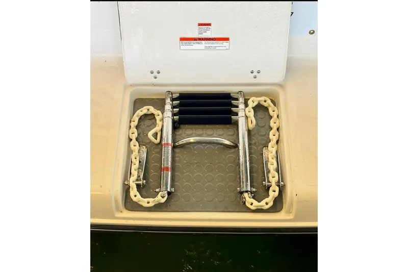 Slide: The Image of 1992 Tiara 270 Sport boat swim platform with ladder and safety chains. - 20