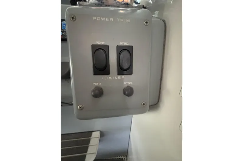 Slide: The Image of Power trim control panel on 1992 Tiara Sport 270 Sport boat. - 17