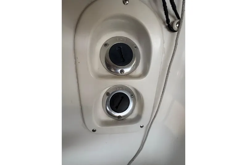 Slide: The Image of Fuel and gas caps on a 1992 Tiara Sport 270 Sport boat. - 22