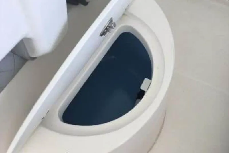 Slide: The Image of Open storage compartment on 2021 Aquasport 2500 Center Console boat. - 12