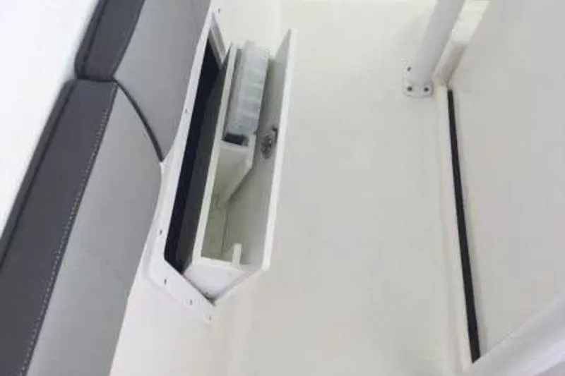 Slide: The Image of Storage compartment on 2021 Aquasport 2500 Center Console boat interior. - 9