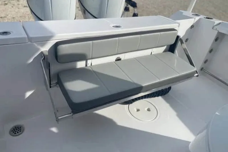 Slide: The Image of 2021 Aquasport 2500 Center Console boat with foldable gray seating. - 13