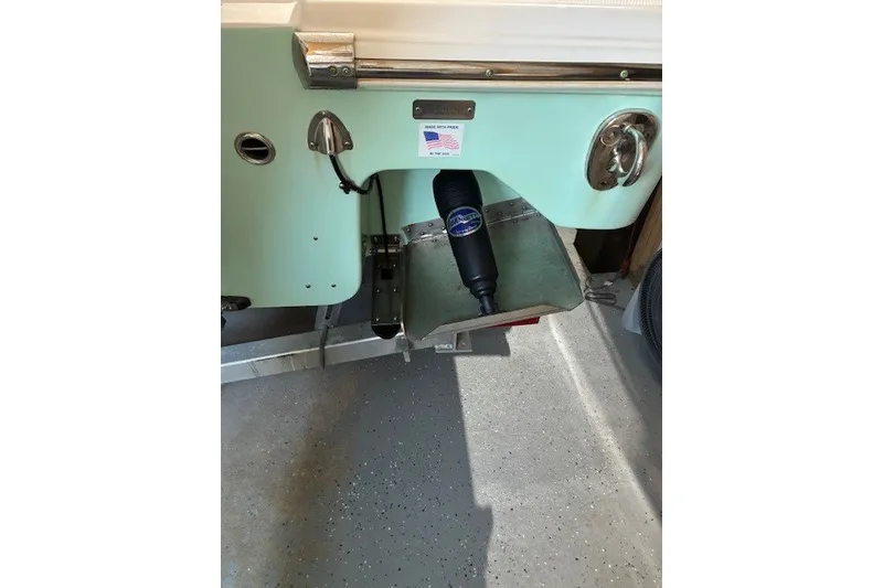 Slide: The Image of 2021 Aquasport 2500 Center Console boat detail with American flag sticker. - 4