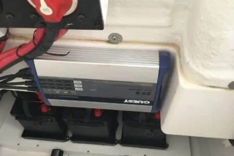 Slide: The Image of Electrical system of 2021 Aquasport 2500 Center Console boat with battery charger. - 17