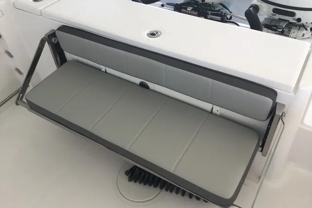 Slide: The Image of 2021 Aquasport 2500 Center Console boat with foldable bench seat in gray and white. - 7