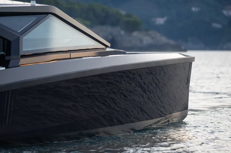 Slide: The Image of Sleek 2027 Wally wallypower50 yacht cruising on calm waters. - 14