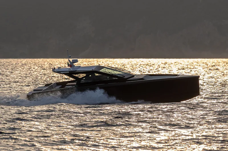 Slide: The Image of 2027 Wally wallypower50 yacht cruising on sunlit water at sunset. - 2