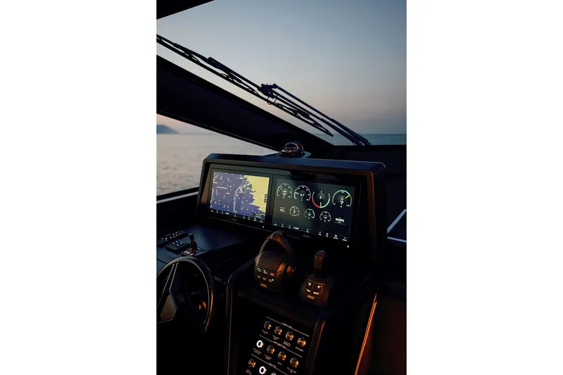 Slide: The Image of Cockpit of 2027 Wally wallypower50 yacht at sunset, featuring advanced navigation displays. - 21