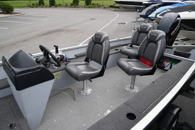 Slide: The Image of The image shows a 2023 Lund 1600 Fury SS model. It features gray seats and a simple dashboard. - 10