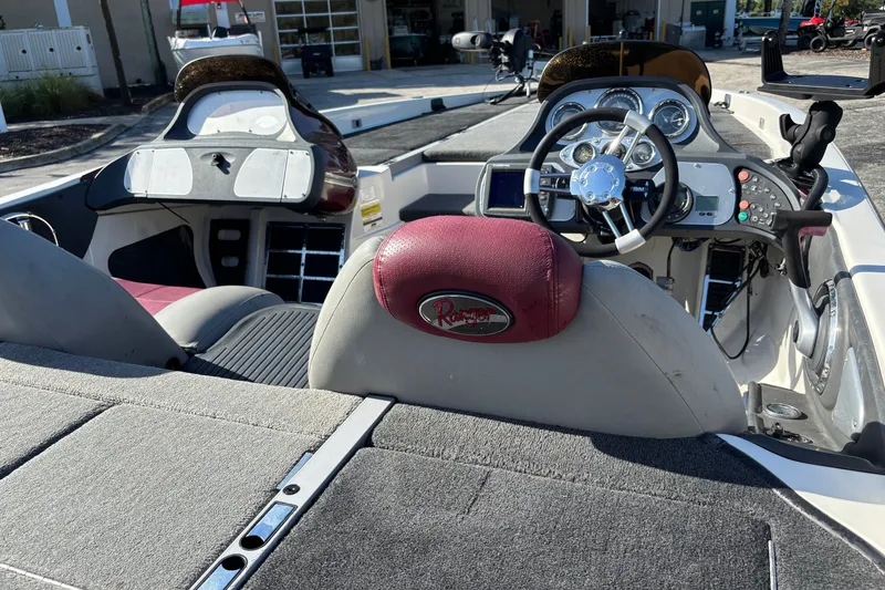 Slide: The Image of 2007 Ranger Z21 Comanche boat interior with steering wheel and dashboard controls. - 5