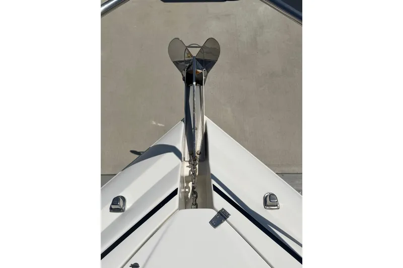 Slide: The Image of Bow view of 2006 Rinker 320 Express Cruiser with anchor and chain. - 16