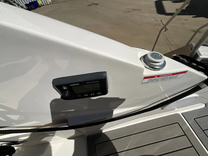 Slide: The Image of Close-up of a boat deck with Fusion audio system and safety warning. - 29