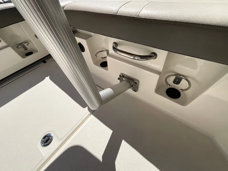 Slide: The Image of Close-up of a boat interior section with a grab handle and sockets. - 14