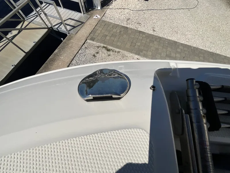 Slide: The Image of Close-up of a boat deck with a metal cover and ladder. - 12