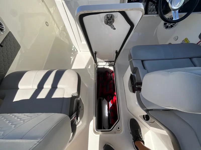 Slide: The Image of Interior of a Sea Ray SDX 250 Outboard with underfloor storage compartment. - 15