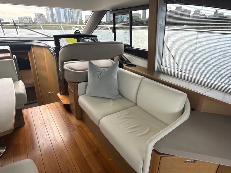 Slide: The Image of Interior of a luxury yacht with sleek wooden floors and comfortable seating. - 46