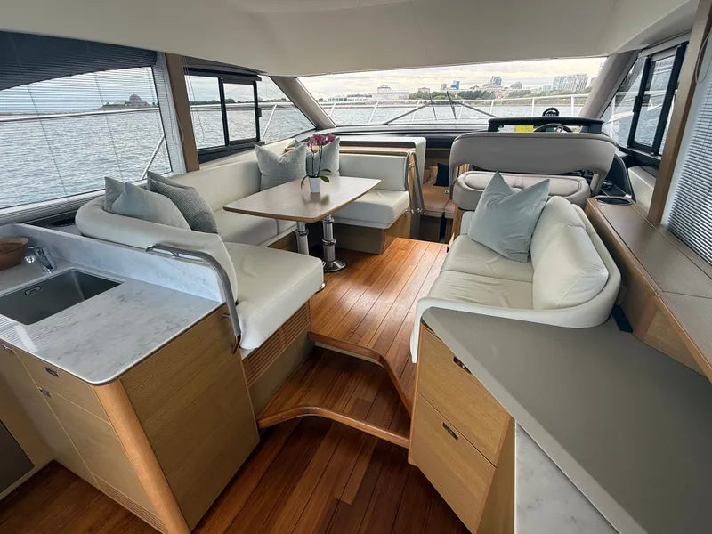 Slide: The Image of Interior of the 2023 Princess F45 with elegant seating and wooden floors. - 43