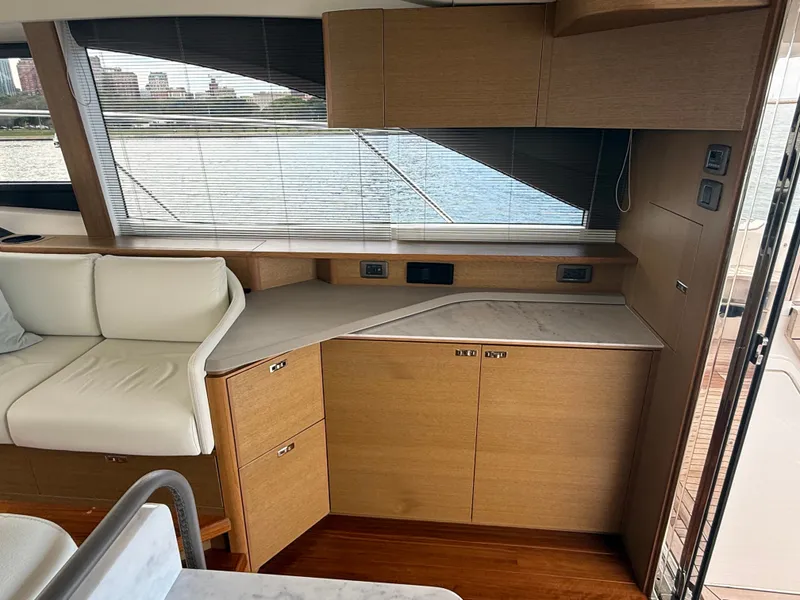Slide: The Image of Interior of the Princess F45 yacht with elegant wood cabinetry and a view of the water. - 49