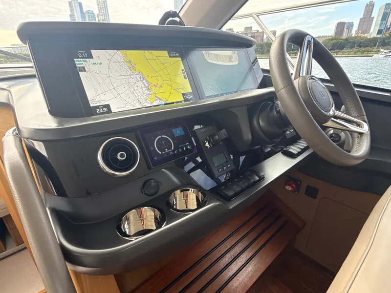 Slide: The Image of The 2023 Princess F45 cockpit features a modern navigation system and sleek steering wheel. - 39