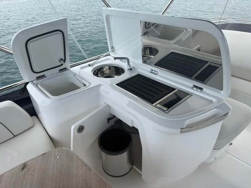 Slide: The Image of The 2023 Princess F45 features a sleek outdoor kitchen with a sink and grill. - 35